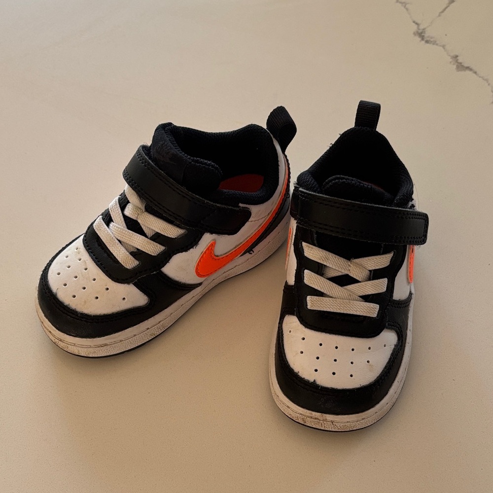 Nike Kids Black White Sneakers with Orange Swoosh